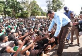 Prime Minister Andrew Holness greet students at Manchester High School