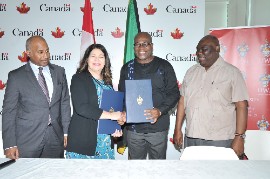 L-R  From left to right: Keith Monrose, Executive Director of Seneca International, and Renata D’Innocenzo, Vice President of Strategy and Brand and President’s Chief of Staff at Seneca Polytechnic, seal the memorandum of understanding (MOU) signing with a handshake alongside Professor Densil Williams, Principal of UWI—Office of the Principal, and Dr. Donovan Stanberry, Campus Registrar of UWI—Office of the Campus Registrar. The signing took place at the High Commission of Canada on Monday, February 19, 2024.