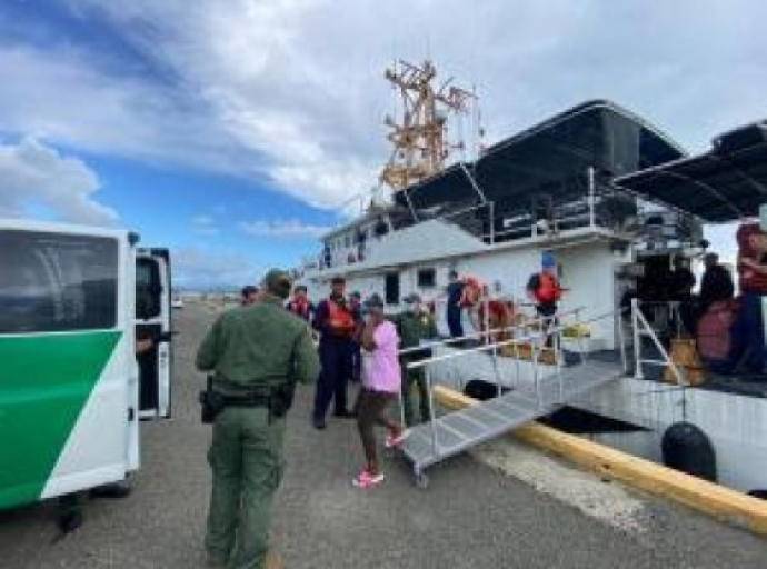 64 Haitian migrants are transferred from a US Coast Guard cutter in Mayaguez Puerto Rico