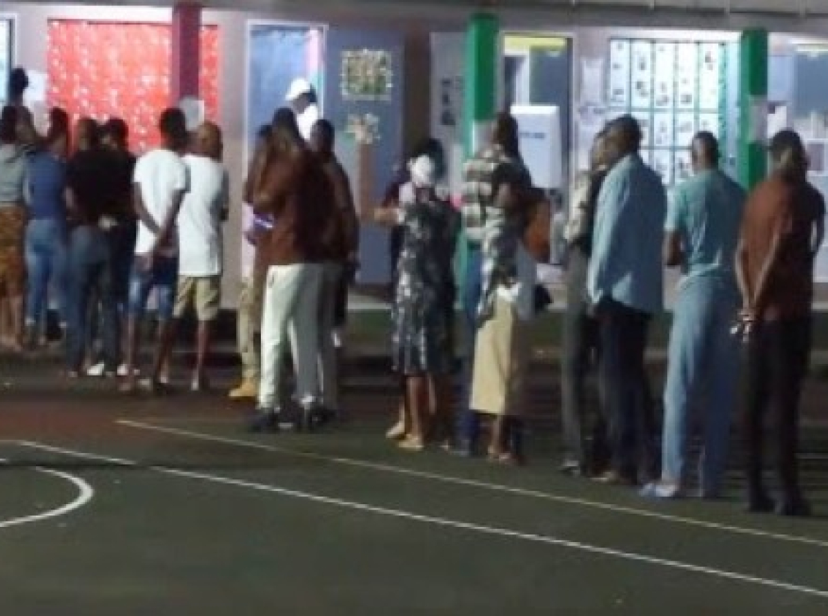 Early morning voters at the St. John City West constituency waiting to cast their ballots (CMC Photo)