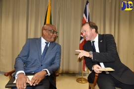 State Minister in the Ministry of Foreign Affairs and Foreign Trade, Senator the Hon. Leslie Campbell (left), is in discussion with British State Minister for the Americas and the Overseas Territories in the Foreign, Commonwealth and Development Office, the Right Hon. Jesse Norman, during a brief ceremony held on Tuesday, (October 25) at the Ministry, downtown Kingston. (Photo by Mark Bell via JIS)