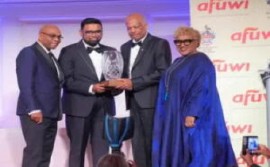 President Irfaan Ali, second from left, receiving the Legacy Award Class of 2024 award at the American Foundation for the University of the West Indies (UWI).