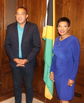 Health and Wellness Minister Dr. Christopher Tufton shares a light moment with Jamaica’s Ambassador to the United States, Audrey P. Marks on his recent visit to the Embassy of Jamaica in Washington DC. (Photo: Derrick Scott.)