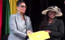 New Grenada Attorney General, Claudette Joseph, receiving her instruments of appointment from Governor General, Dame Cecile La Grenade (CMC Photo)