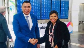 Jamaica’s Ambassador to the United States Audrey Marks says farewell to Jamaica's Prime Minister Andrew Holness after a five-day working visit to the US Capitol, at the Ronald Reagan International Airport in Washington DC. (Photo by Derrick Scott)