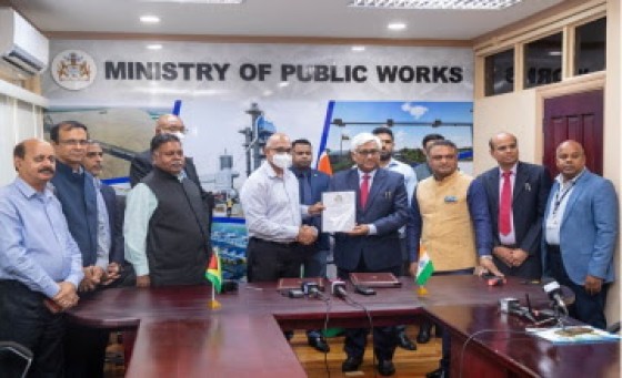 Minister of Public Works, Bishop Juan Edghill, Minister within the Ministry, Deodat Indar, and Dr. KJ Srinivasa, High Commissioner of India to Guyana at the signing ceremony