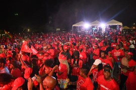 Jubilant supporters of the St. Kitts Nevis Labour Party (SKNLP) celebrate victory on Saturday.