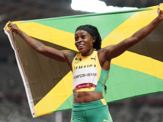 Elaine Thompson-Herah, of Jamaica, reacts after winning the final of the women's 200-meters at the 2020 Summer Olympics, Tuesday, Aug. 3, 2021, in Tokyo. David Goldman/AP