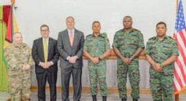 Daniel Erikson (third left) with Chief of Staff of the GDF, Brigadier Omar Khan (third right)