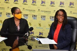 Acting Chief Technical Director of the Policy, Planning and Evaluation Division in the Ministry of Economic Growth and Job Creation, Gillian Guthrie (right), discusses the ‘Polluter Pays’ principle during a recent JIS Think Tank. Acting Senior Director of the Environment and Risk Management Branch within the Ministry, Nicole O’Reggio, looks on.