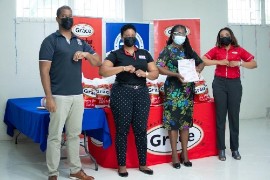 (L-R) Frank James, CEO- GK Foods Domestic Business, joins Andrea Graham, Chief Category Manager, Hi-Lo Food Stores; Patsy Edwards Henry, President of the Nurses Association of Jamaica (NAJ); and Magion Stephenson, Deputy General Manager Grace Foods & Services (GFS) during GK Foods’ presentation of gift packages and gift certificates for Jamaican nurses at the NAJ Offices on September 1, 2021