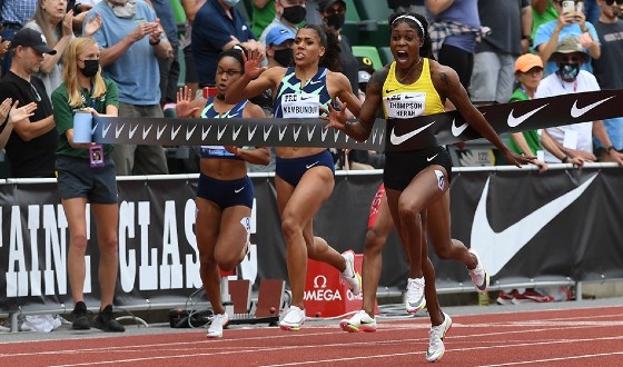 Jamaican Elaine Thompson-Herah hits the wire strongly in the 100 meters in Eugene on Saturday.