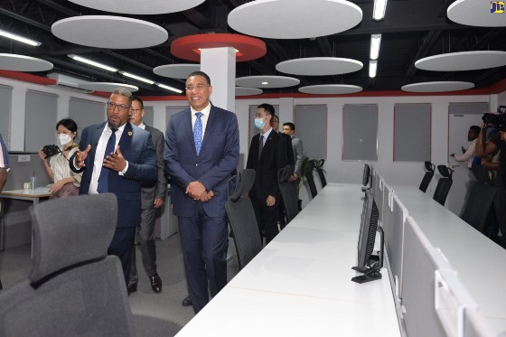 Prime Minister, the Most Hon. Andrew Holness (right), is taken on a tour of Huawei’s new offices located at 97 Hope Road, Kingston 6, by Chief Executive Officer (CEO), Neil Grant. Occasion was the inauguration of the new offices on Thursday October 21. (Photo by Yhomo Hutchinson via JIS)