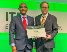 Minister of Tourism and International Transport, Ian Gooding-Edghill (left) and CEO of Barbados Tourism Marketing Inc, Dr. Jens Thraenhart, pose with the Green Destinations Story Award for Environment and Climate at ITB Berlin.