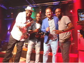 Jamaican Bad Boys of Comedy cast members Drew Thomas (left) and Chris "Johnny" Daley are joined by Consul General Oliver Mair (third left) and Palm Beach resident Hugh Smith (right) after rollicking performances at The Garden in Lauderdale Lakes on Sunday (July 18).