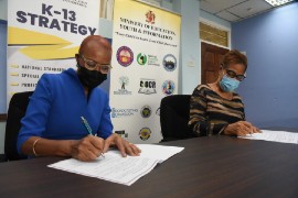 Minister of Education, Youth and Information Fayval Williams (left) and Cuba’s Ambassador to Jamaica, Ineìs Fors Fernaìndez, sign the agreement extending the bilateral cooperation in education between the countries.