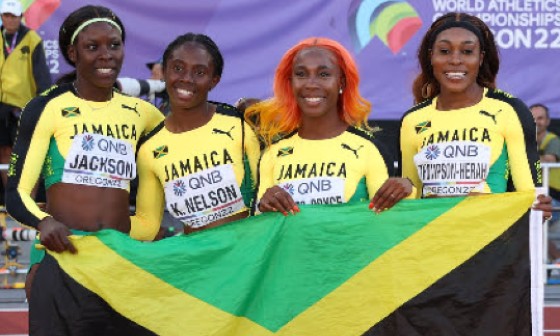 Jamaica’s women sprint relay team after clinching silver at the World Championships. (via CMC)