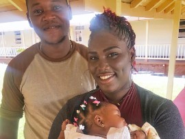 Parents Anastasia Williams and Creaton Johnson with their daughter Cresia Anna at Alexandria Community Hospital in St Ann. (Photo courtesy of UNICEF/JAM)
