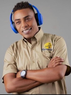 DJ Ron Muschette is all smiles as a new member of The Bridge 99FM