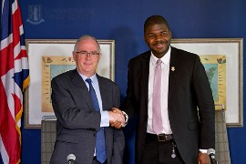 Governor John Rankin (Left) shakes hands with Premier Dr. Natalio Wheatley (Photo via Government of the Virgin Islands)