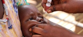 The polio vaccine is administered with a few drops orally and can protect a child for life. (Photo courtesy of the WHO)