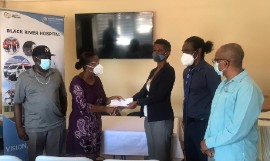 CEO for the Black River Hospital, Diana Brown-Miller (3rd right) accepts the cheque of US $15,000 from Peggy Ewen, family friend of donor Dave Johnson (left), while Senior Medical Officer for the hospital, Dr. Sheriff Imoru (2nd right) and Parish Manager for the St. Elizabeth Health Services, Sean Brissett look on.