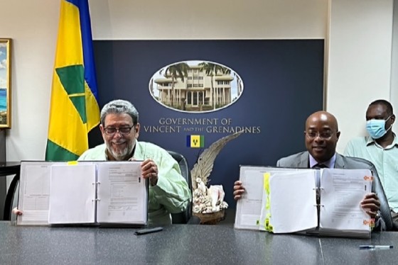 Prime Minister Dr. Ralph Gonsalves after signing the agreement with the CEO of NH International, Kit Kennedy.