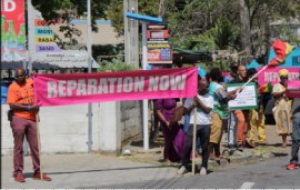 Protesters demanding reparation for slavery as Britain’s royal family makes official visit to St. Vincent and the Grenadines (CMC Photo)