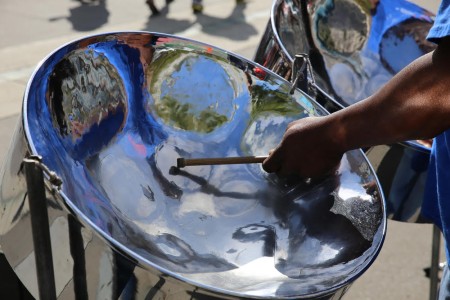 Steel pan drum player with sticks