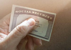 man holding social security card