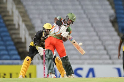 TAROUBA, TRINIDAD AND TOBAGO - MAY 06: Johann Jeremiah of Windward Islands Infernos bats while Deethmar Anderson of Jamaica Titans keeps during match 14 of the West Indies Breakout T20 League between Jamaica Titans and Windward Islands Infernos on May 06, 2025 in Tarouba, Trinidad and Tobago. (Photo by Daniel Prentice/CWI)