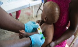 A toddler’s arm is measured to determine malnutrition in Haiti (UNICEF Photo)
