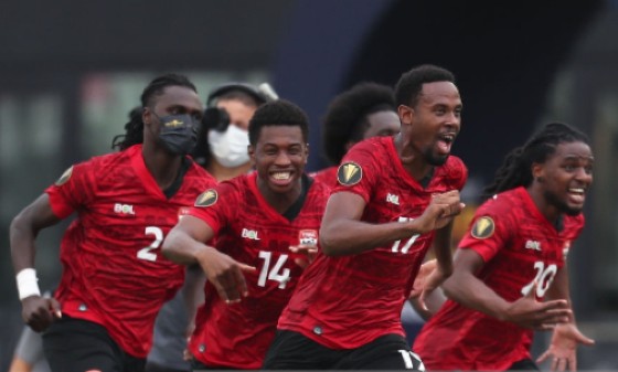 Trinidad and Tobago celebrate after winning their penalty shootout against French Guiana.