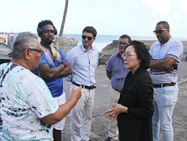 The head of the United Nations Office for Disaster Risk Reduction (UNDRR), Mami Mizutori interacting with persons affected by disasters in recent years in Sandy Bay (CMC Photo)