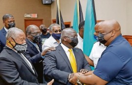 PLP leader, Phillip Davis with yellow tie, greeting trade union leaders following the signing of MoU (Photo courtesy PLP)