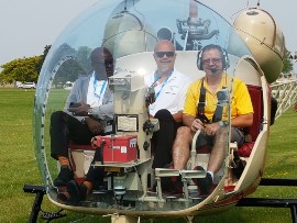 VIP Helicopter Tour – EAA Executives provided Bahamas Ministry of Tourism & Aviation executives with a helicopter tour of the EAA AirVenture Oshkosh grounds, to get a bird’s eye view of the thousands of aircraft and guests attending the ‘Greatest Aviation Show’ in the world.  Pictured left to right is:  Reginald Saunders, Permanent Secretary and Ellison “Tommy” Thompson, Deputy Director General.
