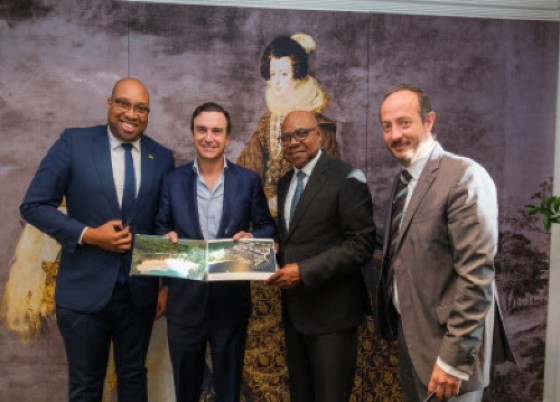 Tourism Minister Edmund Bartlett (second from right) is presented with plans for the expansion of Grand Palladium Resort in Hanover by Abel Matutes, President of Palladium Hotel Group. (JIS Photo)