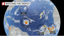 On this wide-view image of the Atlantic, taken on Tuesday, Sept. 28, 2021, Hurricane Sam appears left of center. An area of disturbed weather that was formerly Peter was located several hundred miles to the north of Sam. Additional disturbances (lower right) can be seen as well.