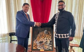 President Chan Santokhi (left) being received by his Guyanese host, President Irfaan Ali on Monday (Office of the President Photo)