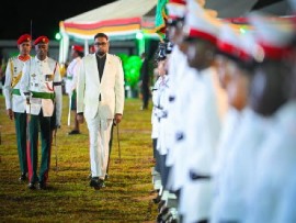 President Irfaan Ali inspecting the guard of honor at the flag raising ceremony on Thursday night
