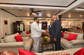President Irfaan Ali (left) greeting Suriname’s Foreign Affairs Minister Melvin Bouva, ahead of their talks on Monday (DPI Photo)