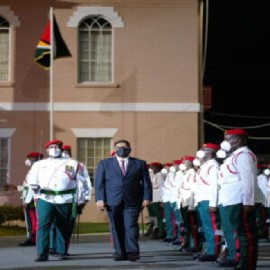 President Ali inspecting Guard of Honour during flag raising ceremony