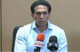 Former attorney general, Faris Al-Rawi speaking at news conference (CMC Photo)