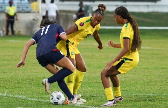 Alyssa Oviedo of the Dominican Republic (left) and Sashana Campbell of Jamaica during their match on Tuesday night. (Photo: CONCACAF)