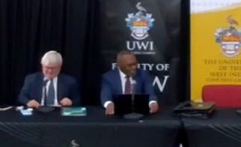 Justice Winston Anderson (right) making his presentation on Friday (CMC Photo)