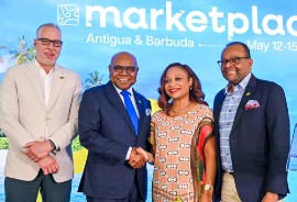 Jamaica Minister of Tourism Edmund Bartlett with CTO Secretary-General and CEO Dona Regis-Prosper at Caribbean Travel Marketplace in Antigua and Barbuda. Also pictured are Philip Rose, Deputy Director of Tourism (left), and Donovan White, Director of Tourism.