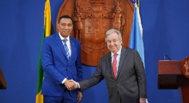 Secretary-General António Guterres (right) and Prime Minister Andrew Holness of Jamaica shake hands prior to their press conference in Kingston, Jamaica. (UN Photo/Jermaine Duncan)