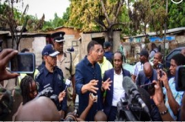 Prime Minister Andrew Holness, flanked by Police Commissioner Major General Antony Anderson and the parliamentary representative for the East Central St. Catherine, Alando Terrelonge, speaking to residents in St. Catherine (JIS Photo)