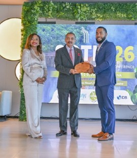 Dr. Dalano DaSouza accepts the tourism intelligence award from CTO Chairman Charles Fernandez, minister of tourism, Antigua and Barbuda, while CTO Secretary-General Dona Regis-Prosper looks on.