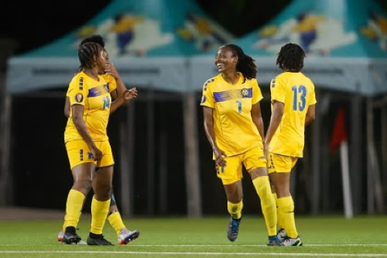 Barbados players (from left) Keinelle Johnson, Shanice Stevenson, and Shauntae Hinds celebrate after their side score a goal (Photo by Miguel Gutiérrez/Straffon Images/Concacaf)